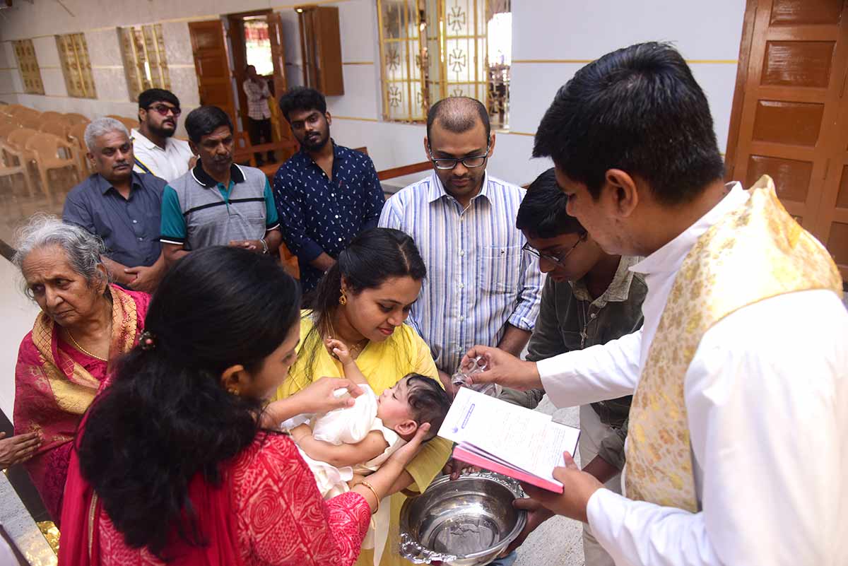 naming-ceremony-photography-album | Rituals held at Infant jesus church Coimbatore